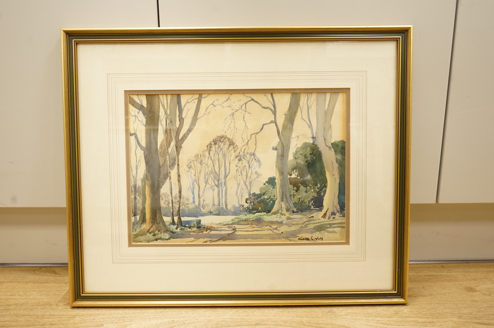 Maurice Canning Wilks (1911-1984), Tree lined pathway with hills beyond, signed, watercolour, 26 x 36cm